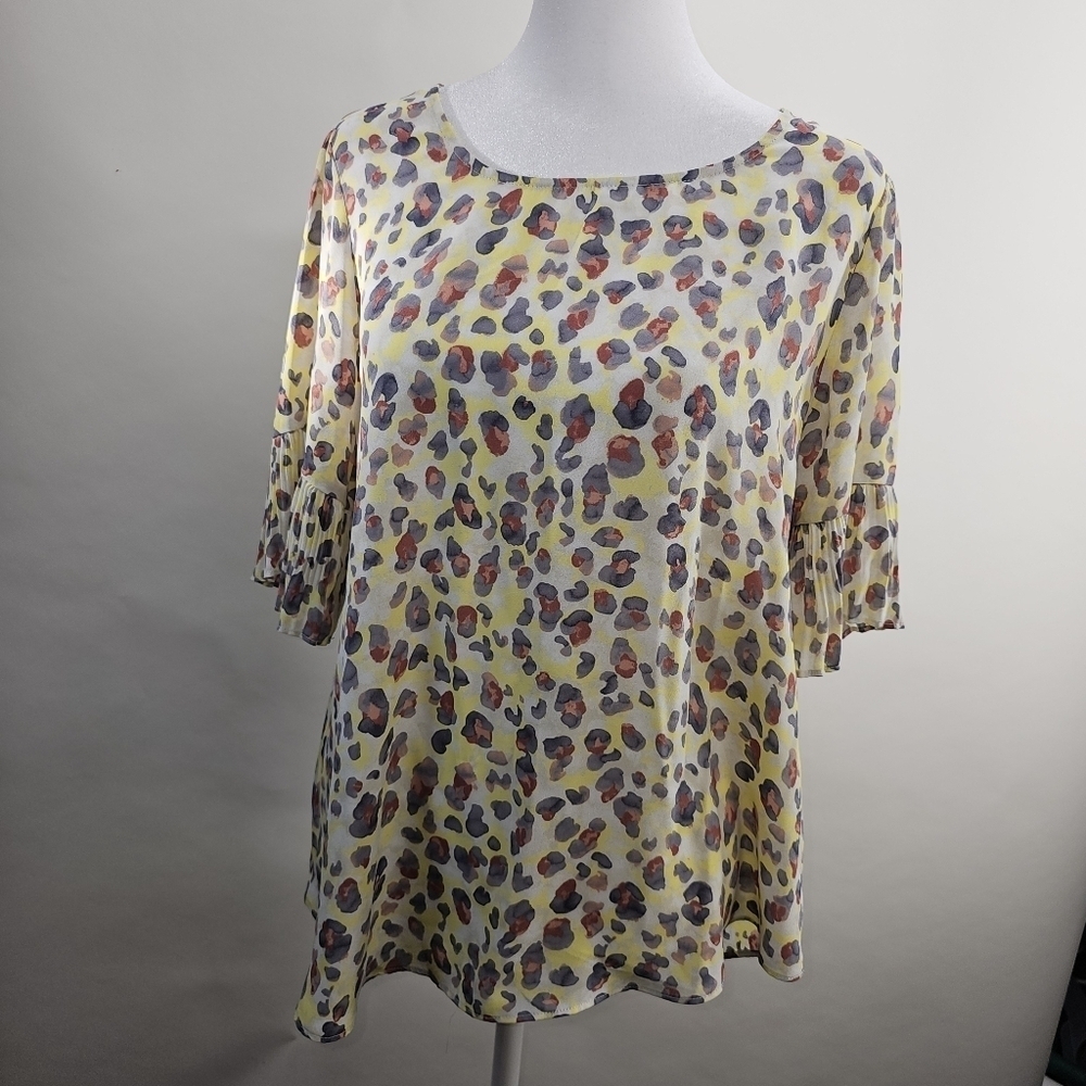 Est. 1946 size small yellow, black, red and white short sleeve blouse.